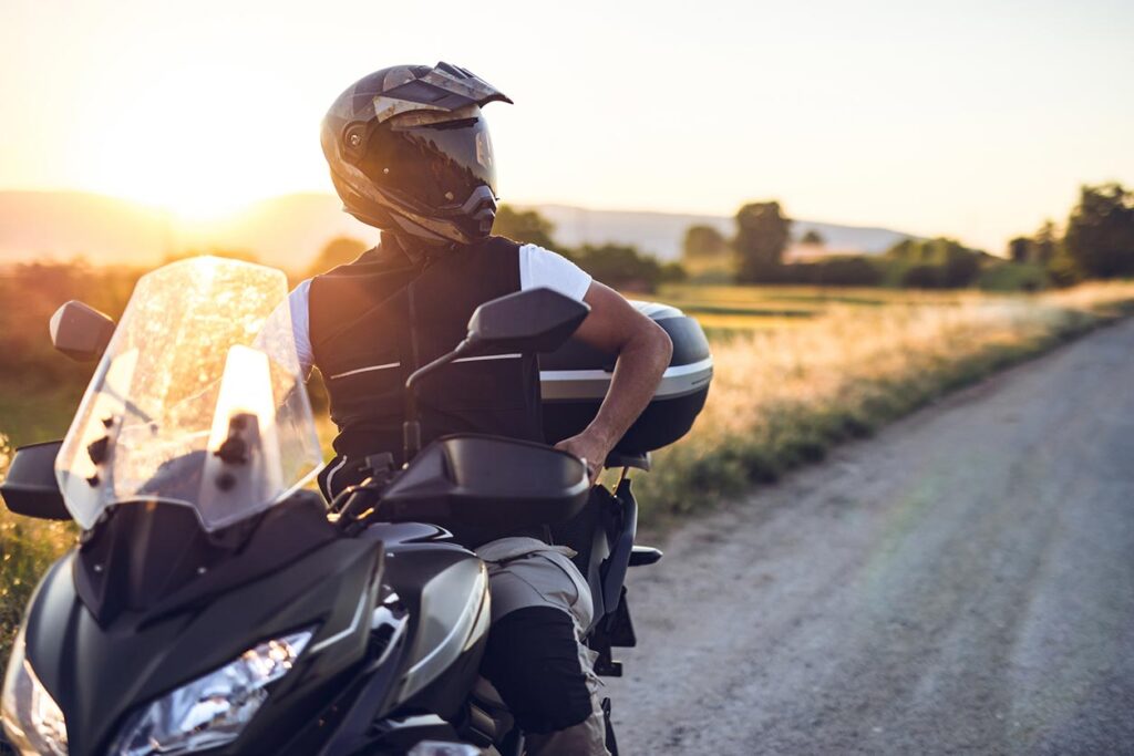 A close up of a person on a motorcycle